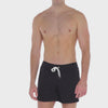 A WHITE WALL VIDEO OF A MALE MODEL WEARING THE SAMMY SHOP UNISEX BLACK EVERYDAY SWEAT SHORT