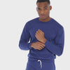 A WHITE WALL VIDEO OF A MALE MODEL WEARING THE SAMMY SHOP UNISEX BLUE EVERYDAY CREW SWEATSHIRT