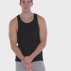 A WHITE WALL VIDEO OF A MALE MODEL WEARING THE SAMMY SHOP UNISEX BLACK EVERYDAY TANK TOP